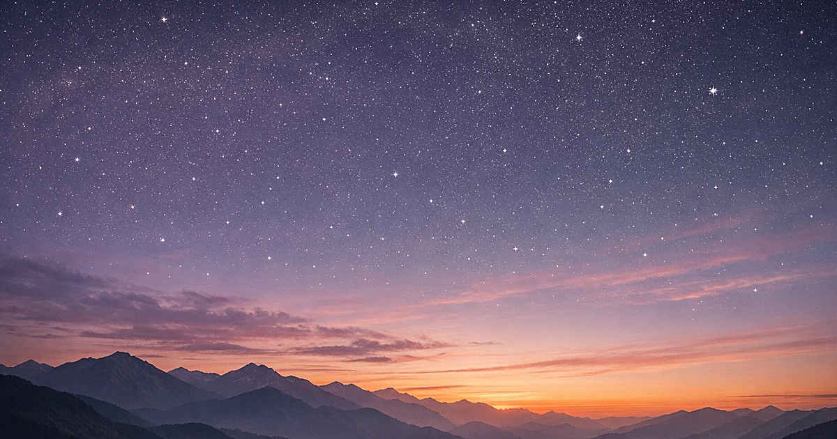 Abstract twilight sky with purple and orange gradient over mountain silhouette with emerging stars