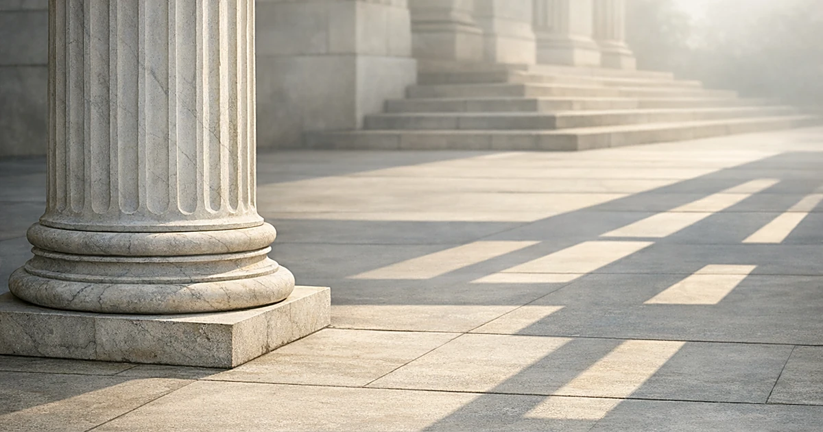 Abstract marble column with geometric shadows representing justice and institutional systems